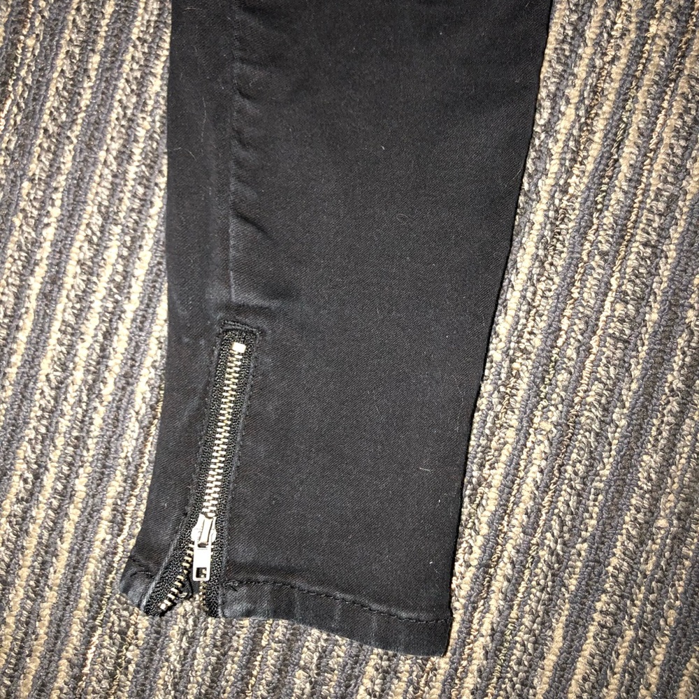 black jeans with gold zipper